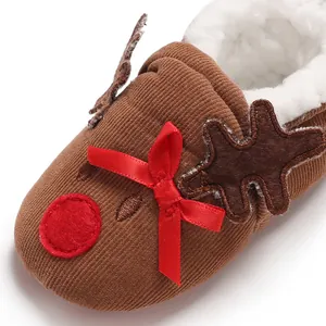 Detail of reindeer baby winter slipper with corduroy texture and fleece lining