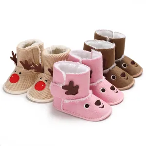Close-up of soft sole baby winter boots with cute reindeer cartoon designs in multiple colors.