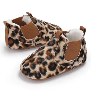Close-up of leopard print baby winter walking shoes with soft faux fur lining