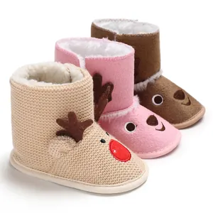 Detail view of reindeer baby winter boots in pink, brown and beige colors