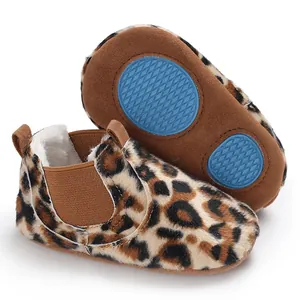 Detail view of warm leopard print baby winter walking shoes with non-slip blue soles