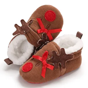 Close-up of cute baby reindeer winter shoes with corduroy fabric and warm fleece lining