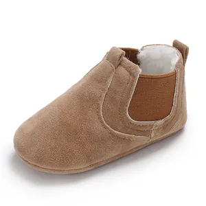 Detail view of warm fleece-lined brown baby walking shoes for winter comfort and support.