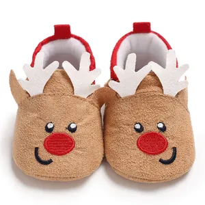 Close-up frontal shot of plush brown baby pre-walker shoes featuring a reindeer design