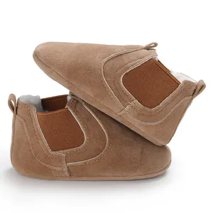 Detailed side view of brown suede baby winter boots with warm lining