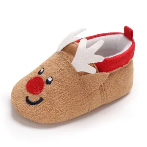 Detailed side view of soft brown reindeer baby walker shoe with white felt antlers and red nose