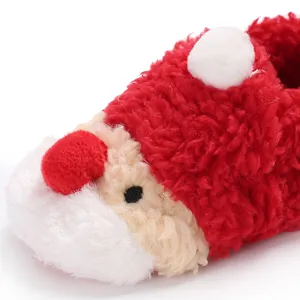Close-up detail of plush Santa Claus baby winter shoe showing soft fuzzy texture