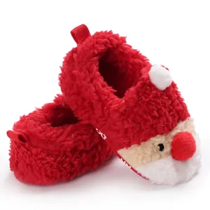Detailed macro view of plush red Santa Claus baby shoes for winter warmth and comfort