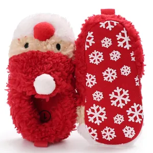 Detail of Santa Claus baby slippers showing plush texture and snowflake non-slip sole