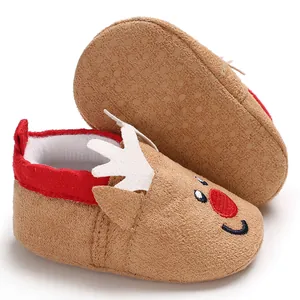 Detailed macro view of reindeer themed baby winter shoes with soft sole and embroidery detail