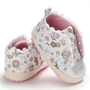 Floral print soft sole baby toddler shoes with silver toe cap and scalloped edges.