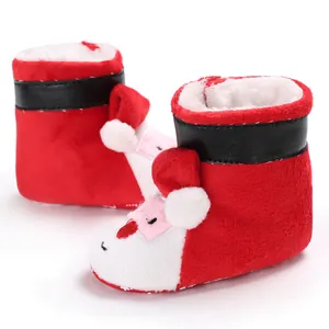 Detailed view of plush baby Santa Claus winter booties with cozy faux fur lining