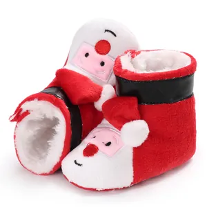 Detailed macro view of plush Santa Claus baby booties with a warm soft fur lining.