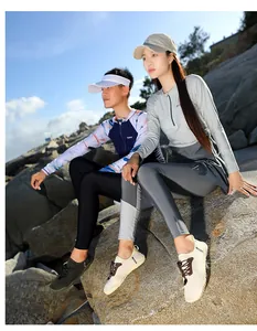 Detail view of breathable outdoor water shoes for couples shown on coastal rocks