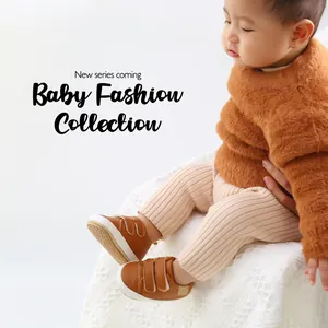 Toddler in brown leather sneakers with velcro straps for spring and autumn comfort.