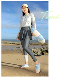 Detailed macro view of colorful non-slip water shoes worn by a model on a sunny sandy beach