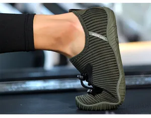 Close-up detail of flexible outdoor water shoe showing extreme sole bend on treadmill