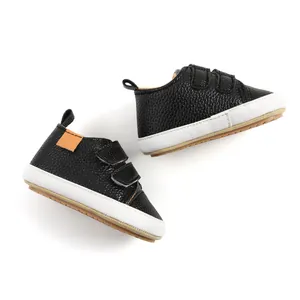 Classic black textured leather baby walker shoes featuring secure double velcro straps