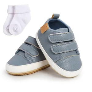 Set of stylish blue baby walking sneakers with matching white cotton socks for infants