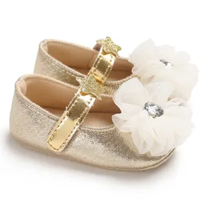 Detail showing golden PU baby princess shoes with white gauze flower and diamond