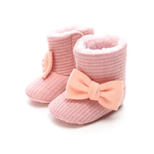 Soft-soled pink baby winter boots with warm fleece lining and large bow decoration