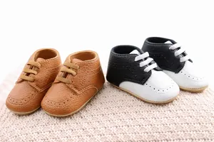 Soft sole baby pre-walker PU leather shoes in brown and black-white styles.