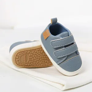 Close-up of blue baby walking shoes with soft rubber soles and Velcro straps