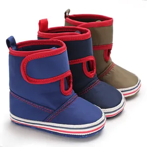 Collection of three pairs of baby soft sole walker boots in blue, navy, and khaki colors.