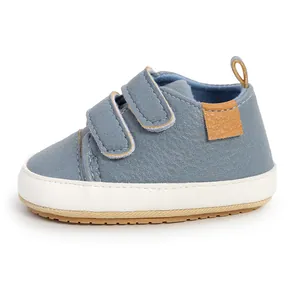 Side view detail of soft blue faux leather baby walker shoes with double velcro straps