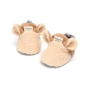 Close-up of cute cartoon baby winter shoes featuring soft fleece and warm inner lining