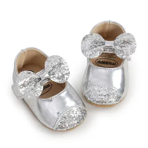 Detailed view of silver sequin bow baby princess shoes with soft soles for toddlers