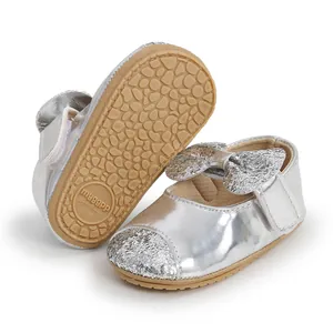 Silver glitter bow baby walking shoes with soft non-slip rubber sole detail
