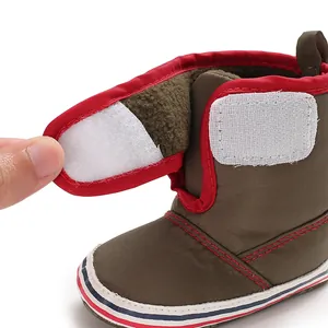 Close-up of soft-soled baby toddler boots showing Velcro fastener and fleece lining