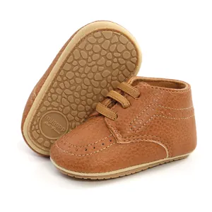 Professional close-up of brown baby PU leather walking shoes with soft non-slip sole