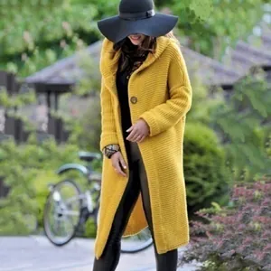 Detailed close-up view of women's long mustard yellow knitted cardigan sweater coat outfit
