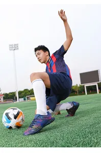 Chaussures de football extérieur à motifs vibrants pour entraînement professionnel
