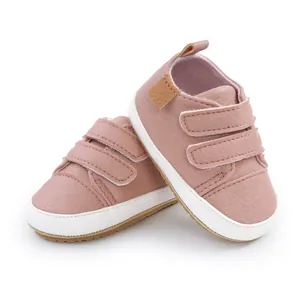 Soft pink leather baby walking shoes with double hook and loop straps for toddlers