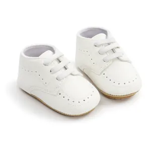 Close-up of white soft sole baby walker shoes with PU leather and elastic laces