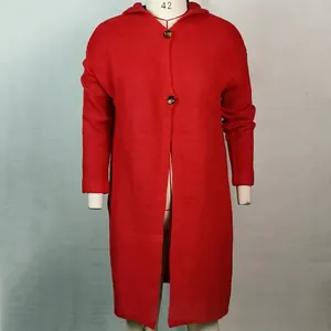 Close-up detail of women's red long-line hooded knit cardigan sweater on a mannequin