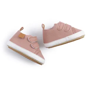 Detailed view of soft pink infant toddler shoes with double hook and loop velcro straps