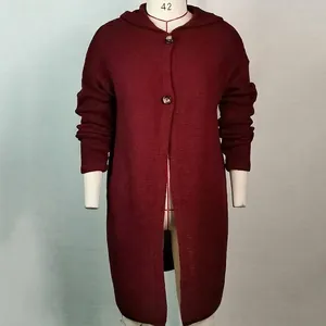 Close-up of a burgundy hooded knit cardigan featuring two large buttons on a mannequin