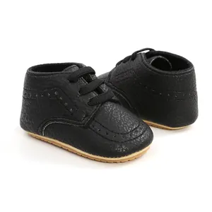 Detailed view of black PU leather baby walker shoes featuring soft non-slip soles