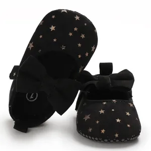 Schwarze Baby-Prinzessin-Lauflernschuhe mit goldenen Sternen und Schleifendetails