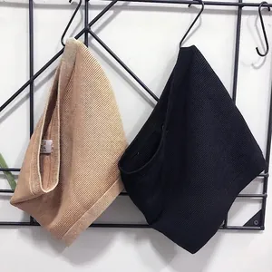 Detailed view of seamless ribbed compression waist shaper belts in black and tan colors