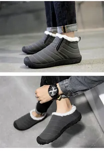 Nahaufnahme grauer Winterstiefel mit warmem Kunstfellfutter und weicher rutschfester Sohle