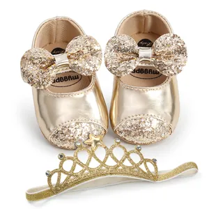 Detail of gold sequin baby princess shoes with matching crown headband