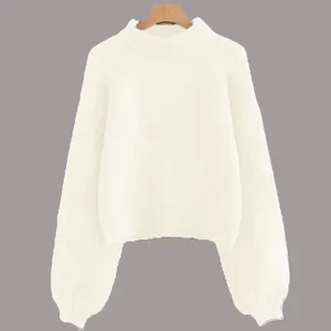 Detailed view of women's white round neck knitted pullover sweater with puff sleeve design
