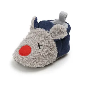 Detailed view showing the soft fleece texture and cute cartoon mouse design on baby shoe
