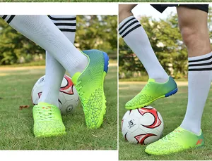 Close-up detail of youth turf soccer shoes featuring a vibrant lime green gradient finish