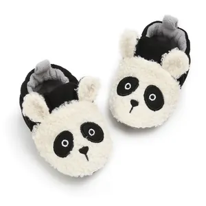 Detailed top view of panda-themed warm winter baby booties with soft fleece texture